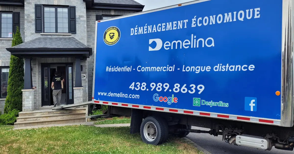 Professional movers in Dollard-des-Ormeaux loading furniture into a moving truck